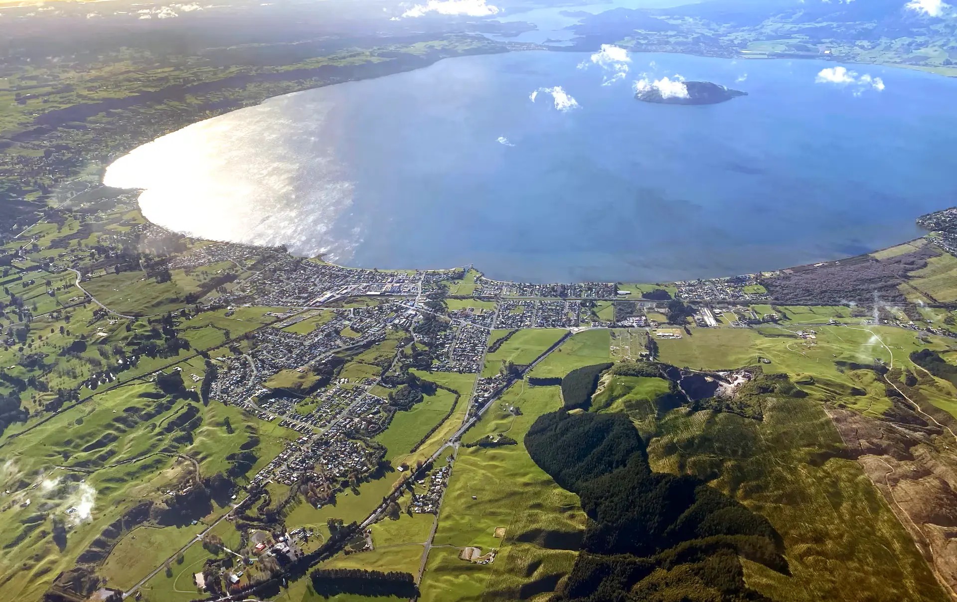 View of Lake Rotorua and Rotorua city from overhead.
