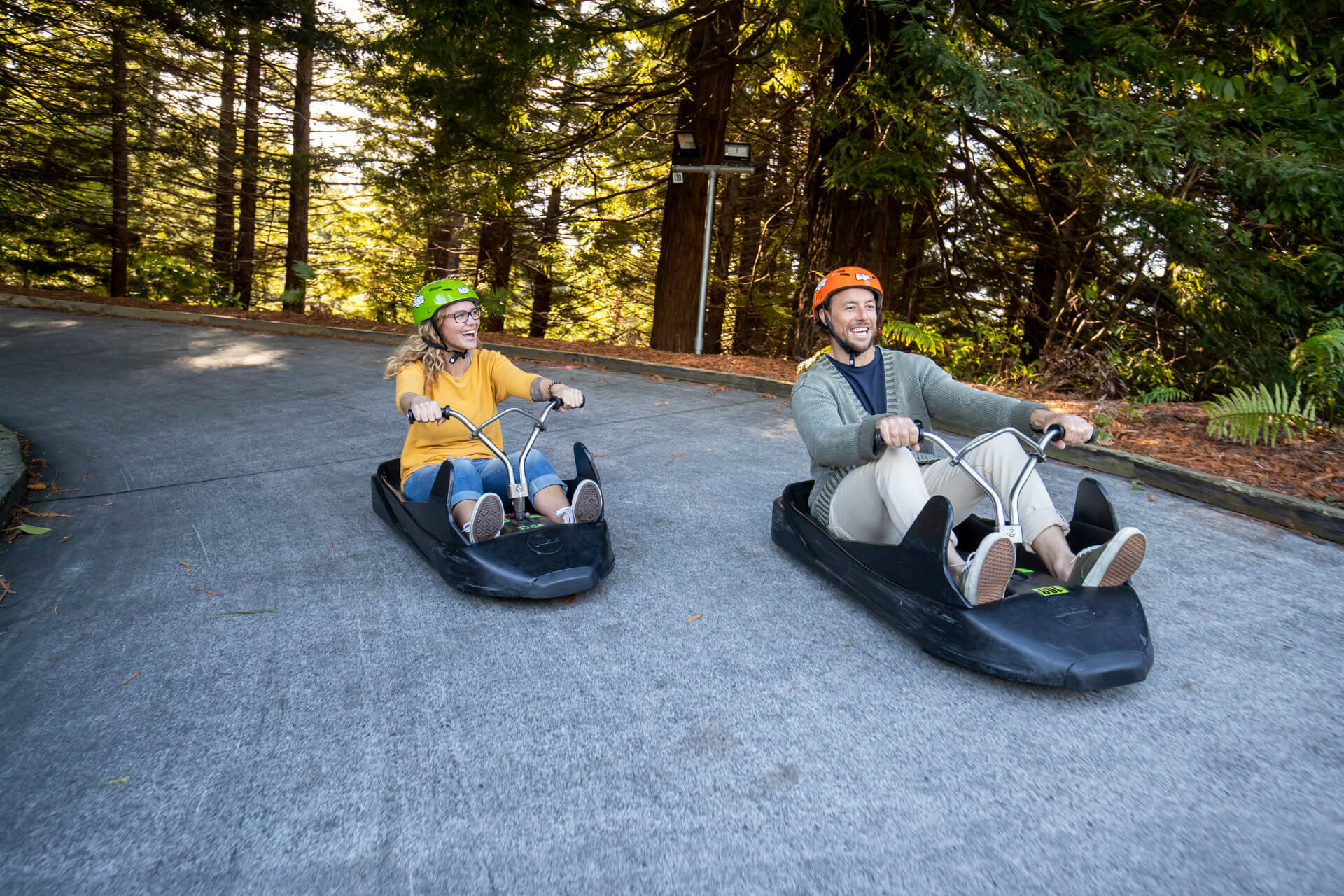 Two Friends Racing Each Other On The Skyline Rotorua Luge