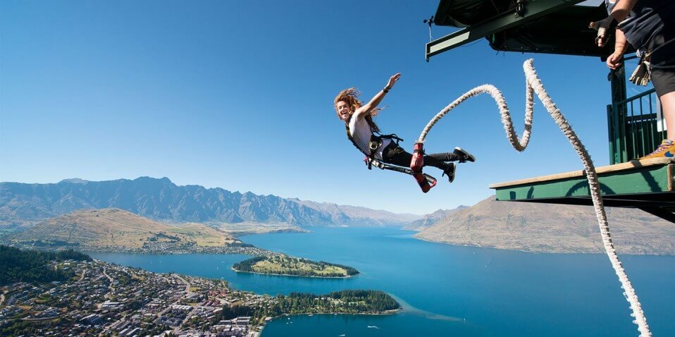 Lady bungy jumping off the Ledge Bungy at Skyline Queenstown.