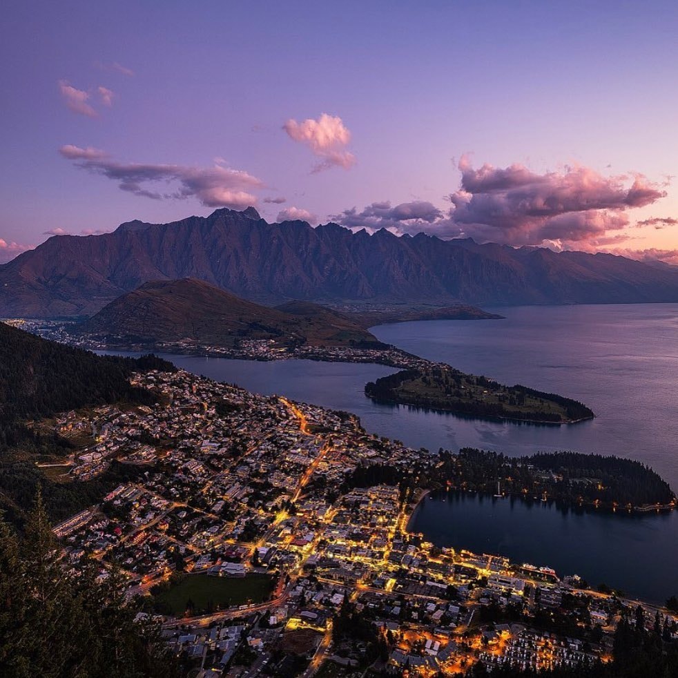 A magical sunset lights up the sky with purple hues.