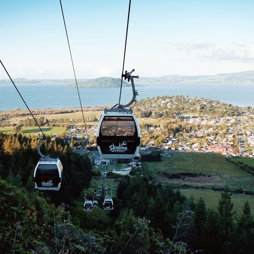 A Skyline Rotorua Gondola cabin ascends Mount Ngongotaha high above Lake Rotorua.