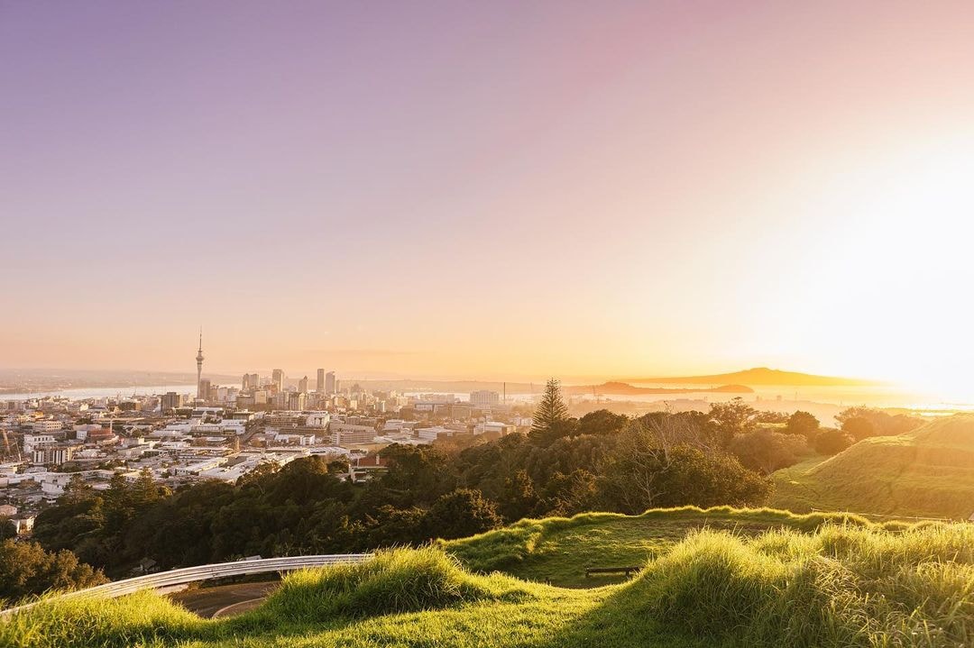 A stunning sunrise capture of the Auckland cityscape as seen from One Tree Hill.