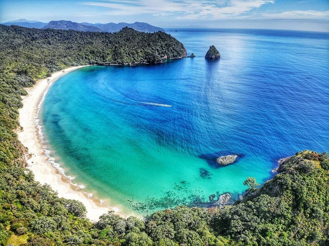 A drone perspective of New Chums beach in the Coromandel on a summers day.