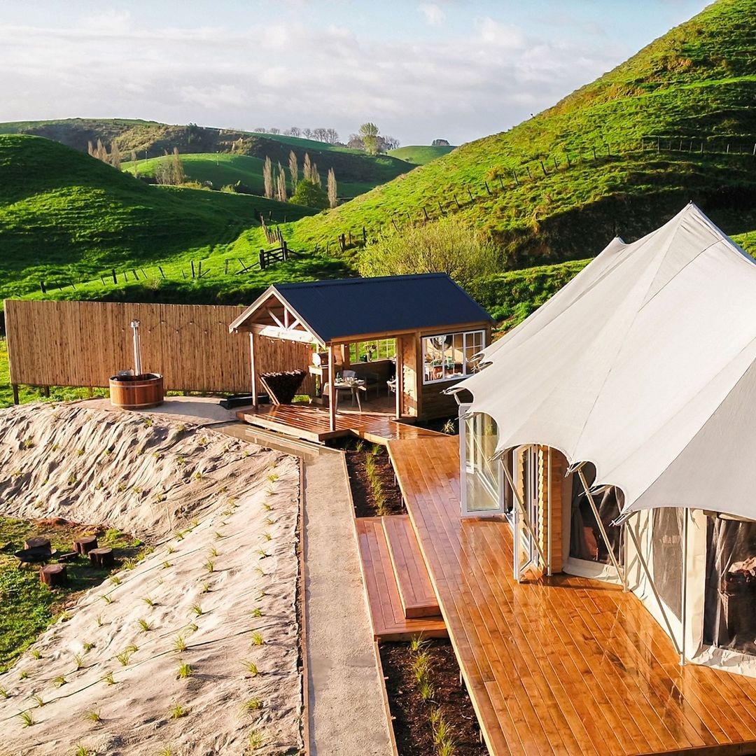 A drone view of the stunning accommodation at Orchard Valley Glamping in Waikato.