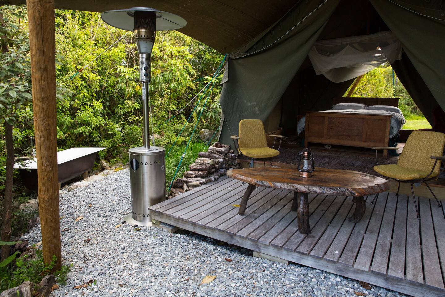 The luxury tent, deck and hot tub at Kaniere Tailings Luxury Camp located in Hokitika.