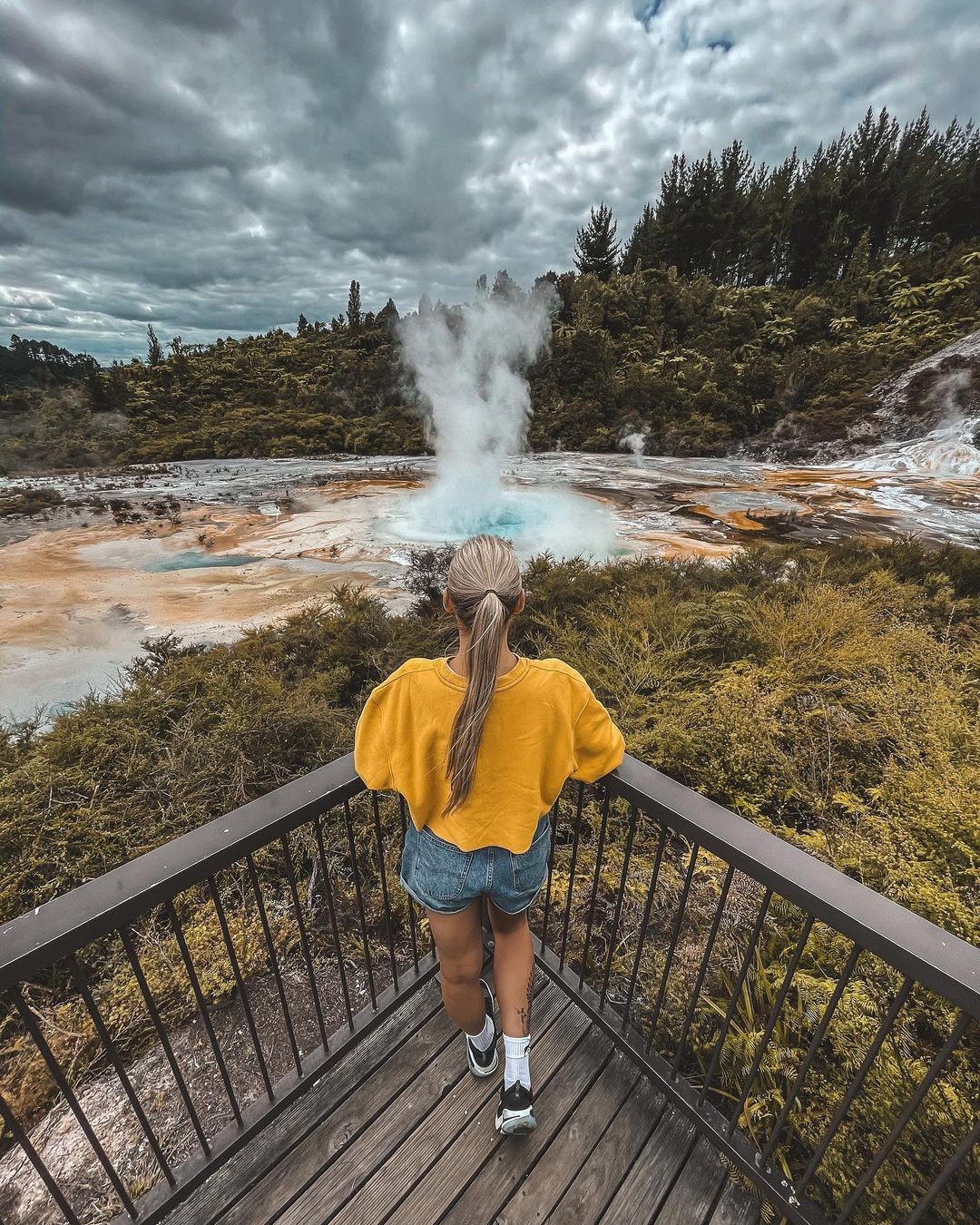 A woman marvels at a geyser erupting at Orakei Korako in Rotorua.