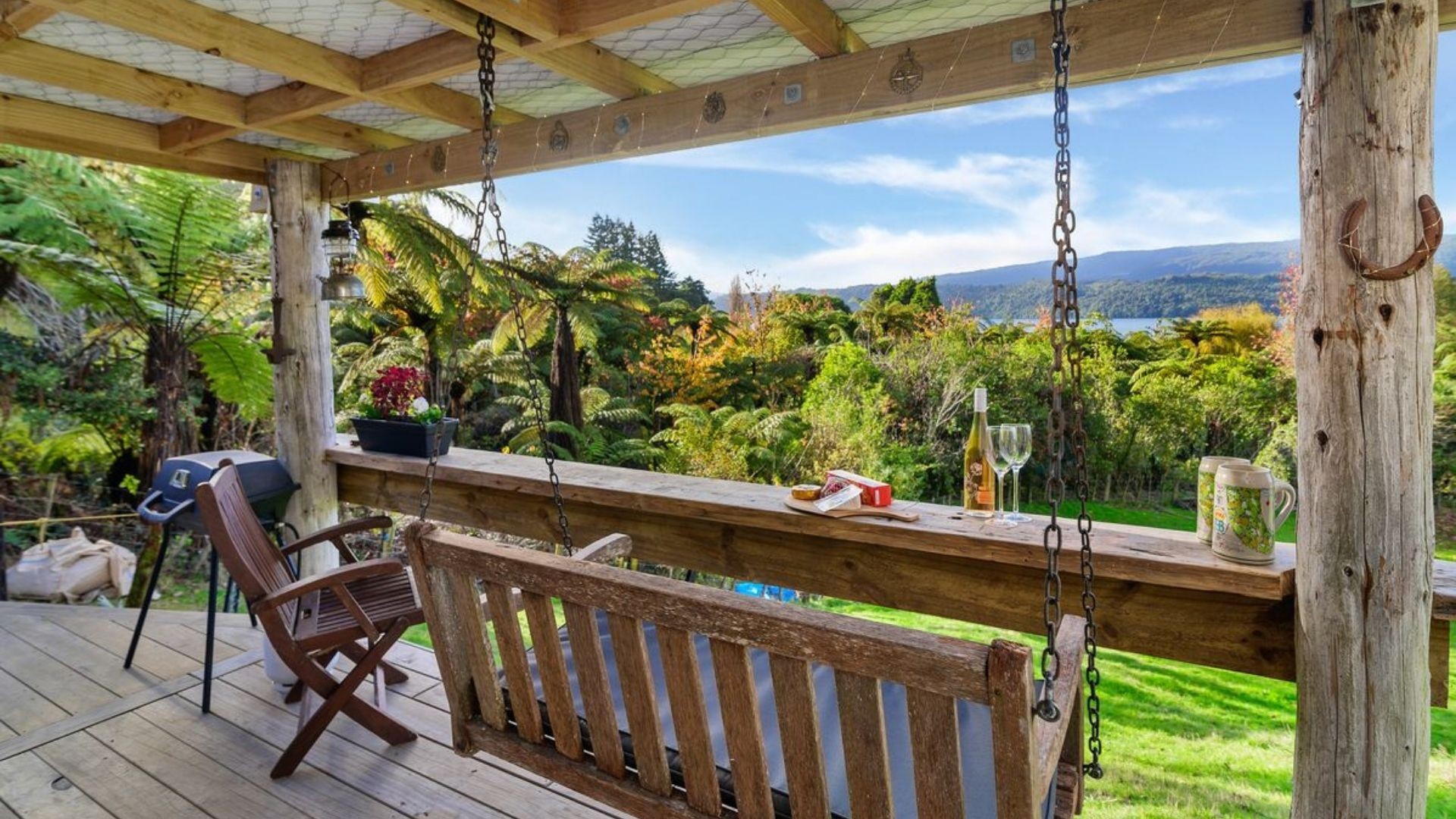 A swinging chair with an incredible view of Lake Tarawera from Jacks Hut.