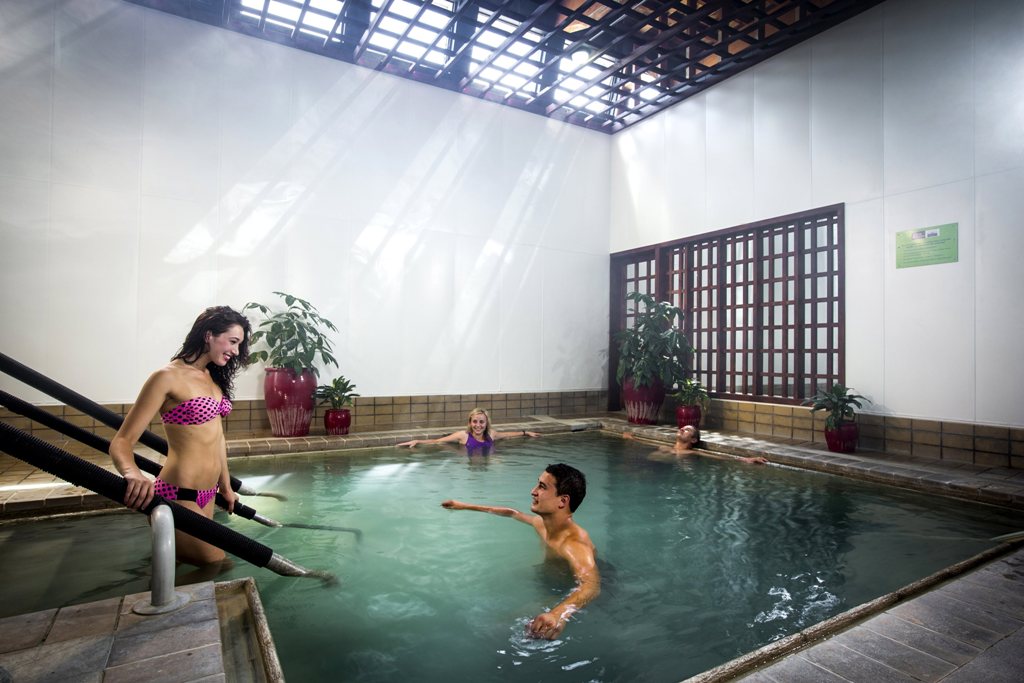A women enters the natural thermal pools at QE Health in Rotorua.