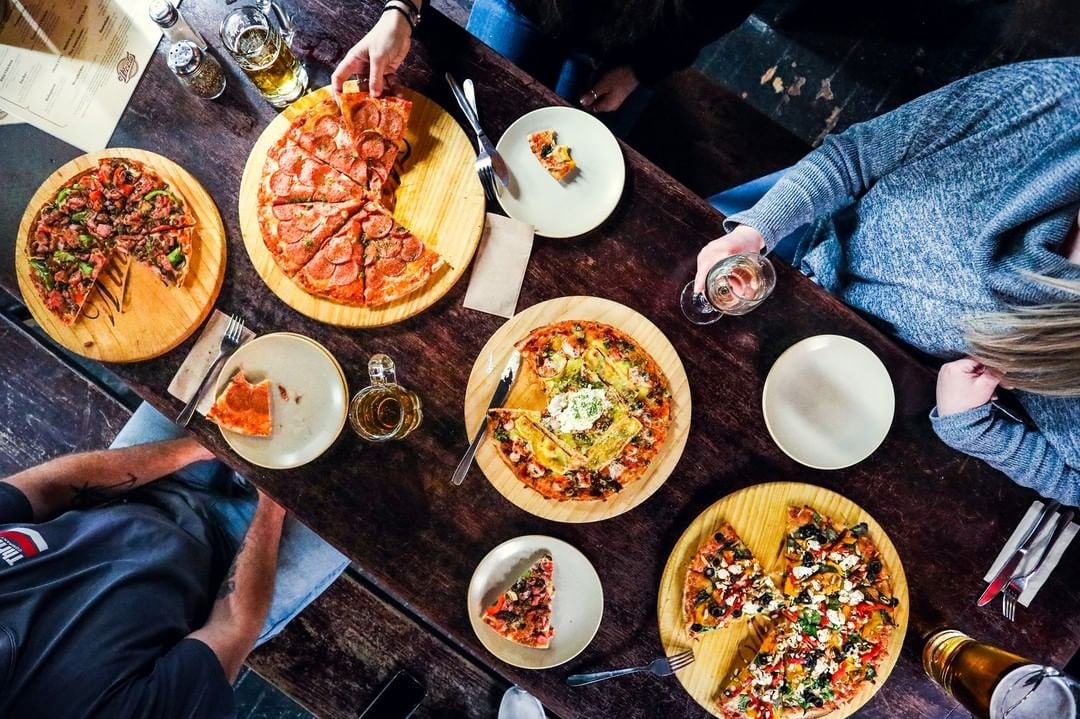 An aerial photo of a delicious spread of pizzas at Winnies Pizza Bar in Queenstown.