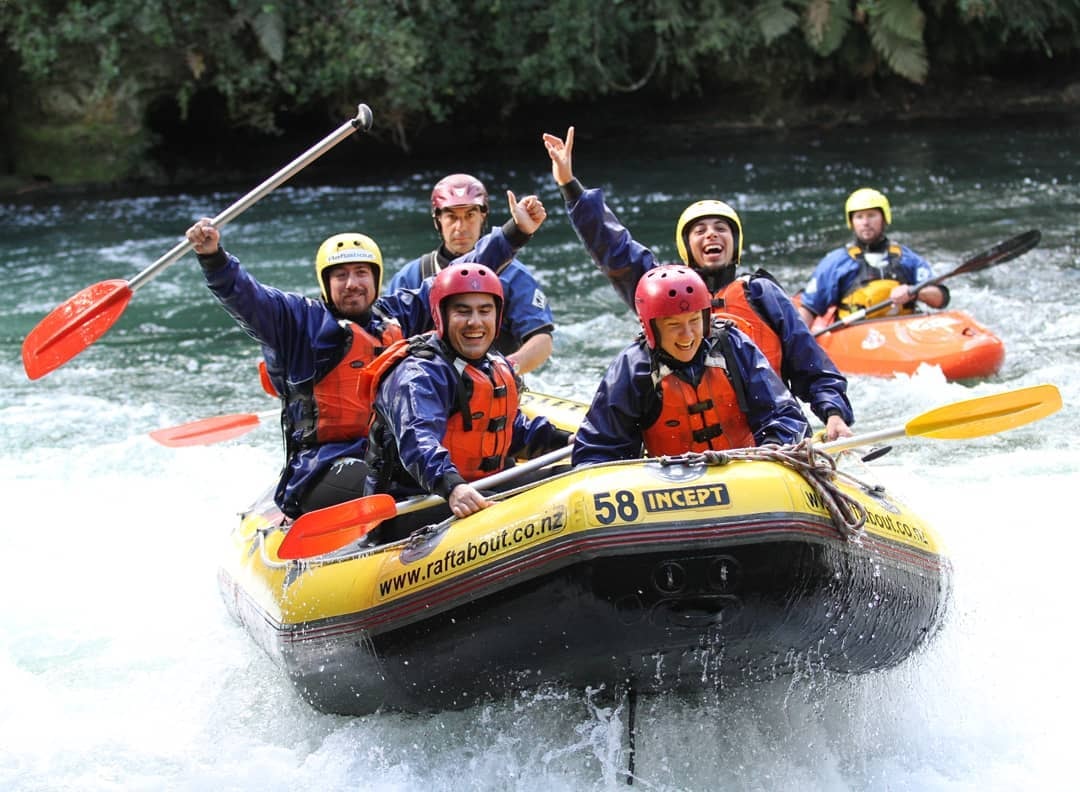 People pose for a photo on a Raftabout guided trip on the Kaituna River, Rotorua.