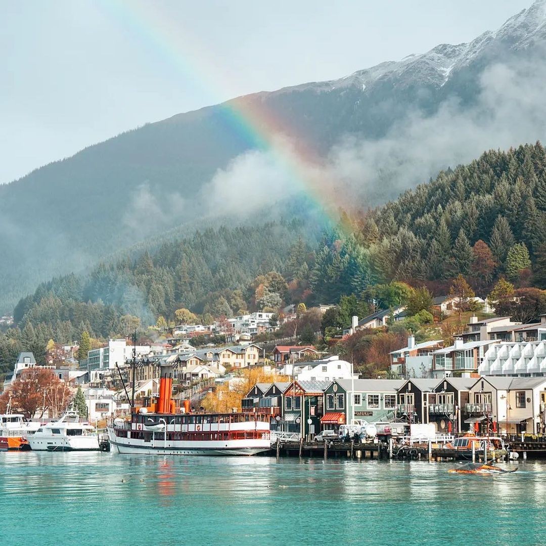 A rainbow forms over steamer wharf in the heart of Queenstowns lakeside dining district.