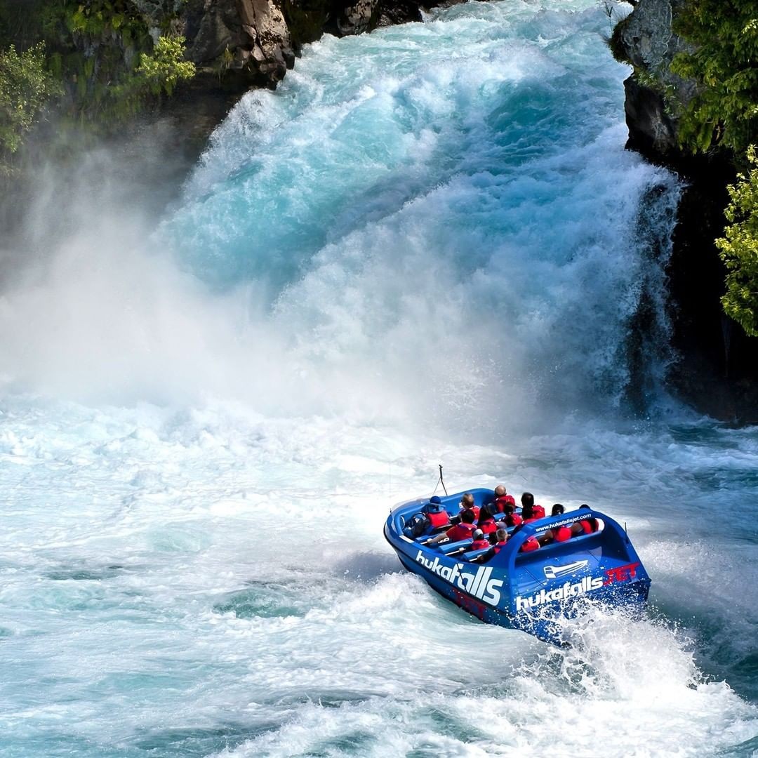 A jet boat approaches the base of might Huka Falls in Taupo.