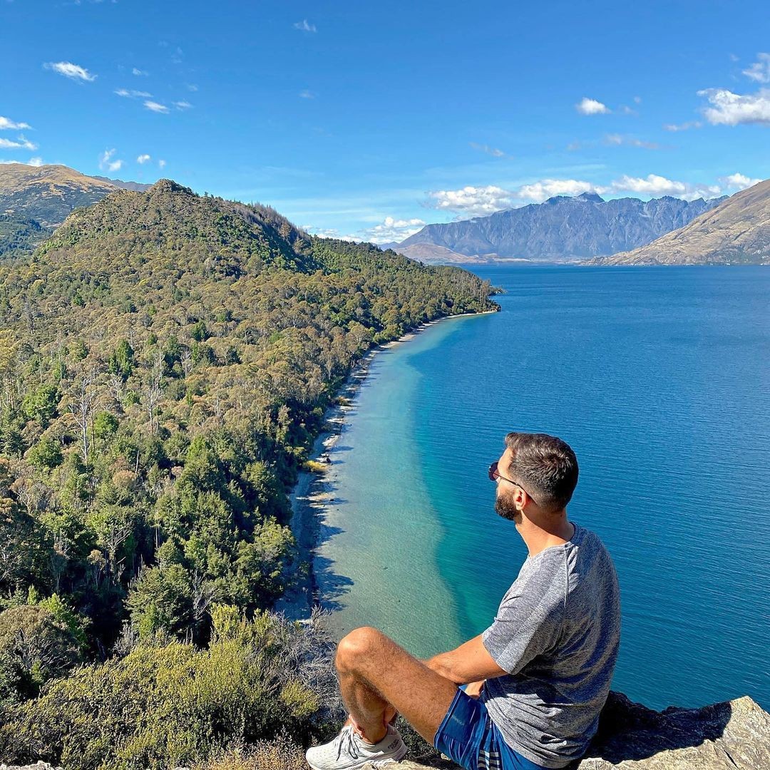 A man stares out over the incredible views from the Bob's Cove walking track lookout point.