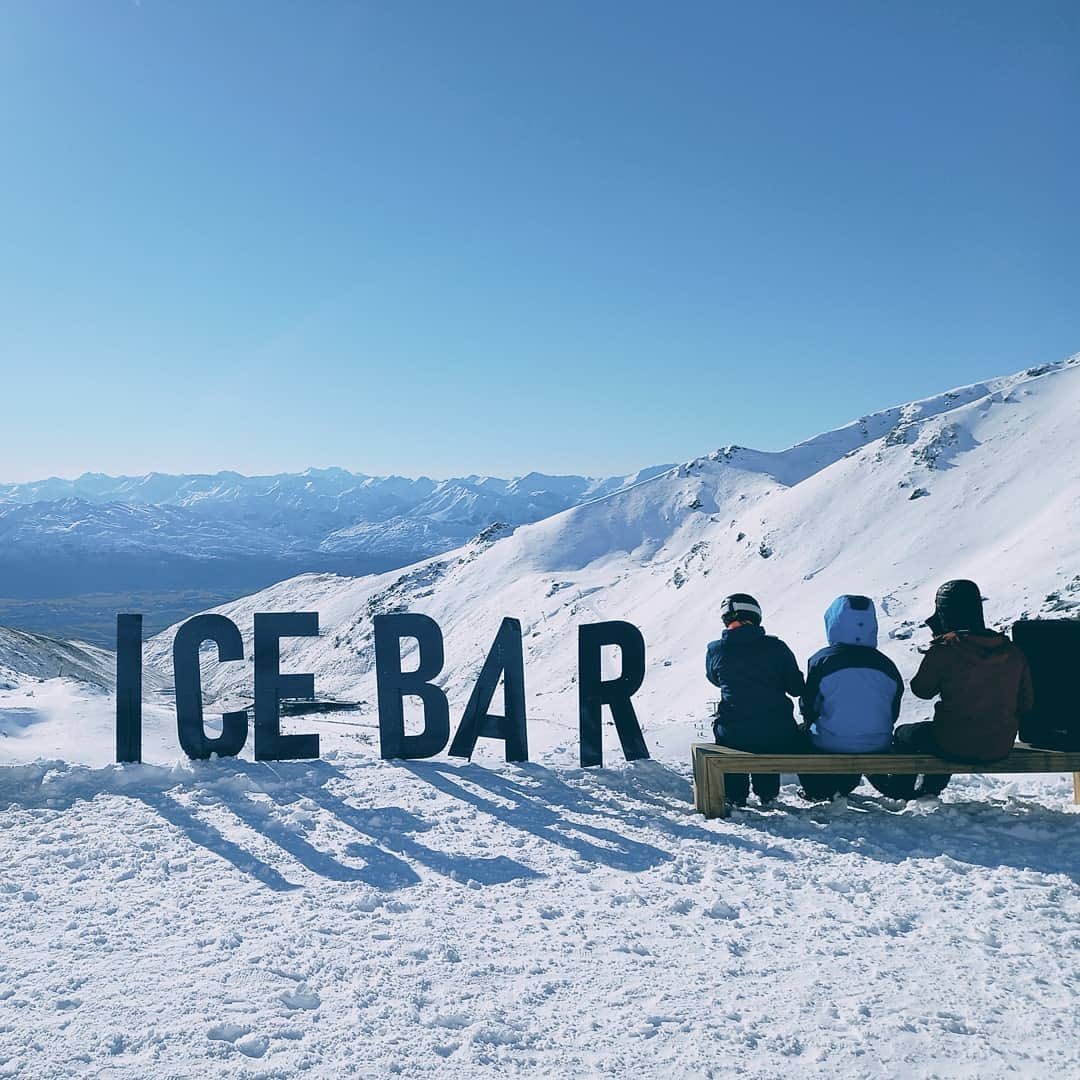 Some friends enjoy some après ski drinks at the Ice Bar up The Remarkables mountain in Queenstown.