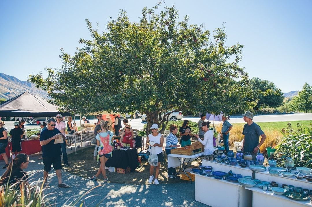 Stall holders chat with visitors at the Wanaka Artisan Market.