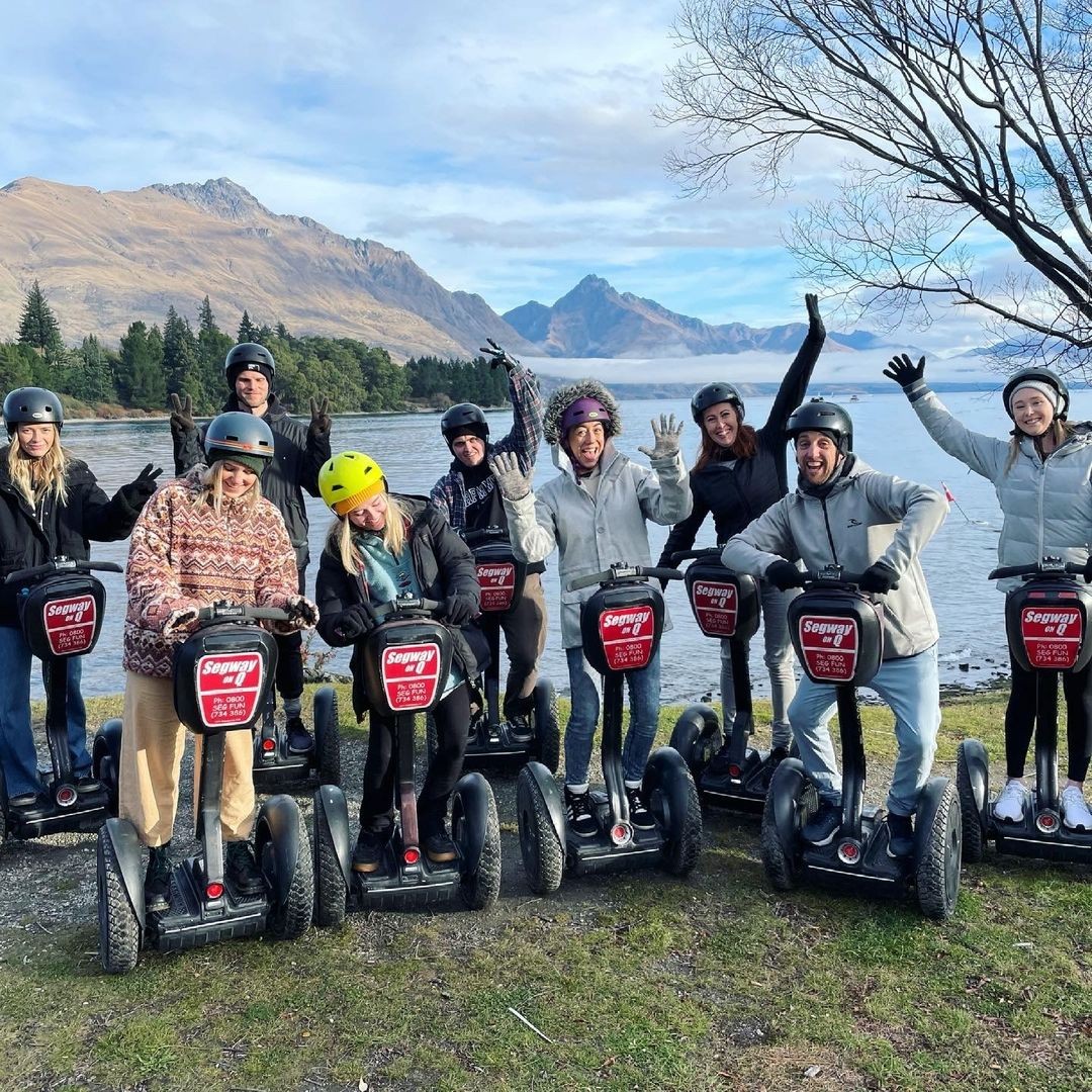 A group of friends poses for a photo on their segway tour around Queenstown.