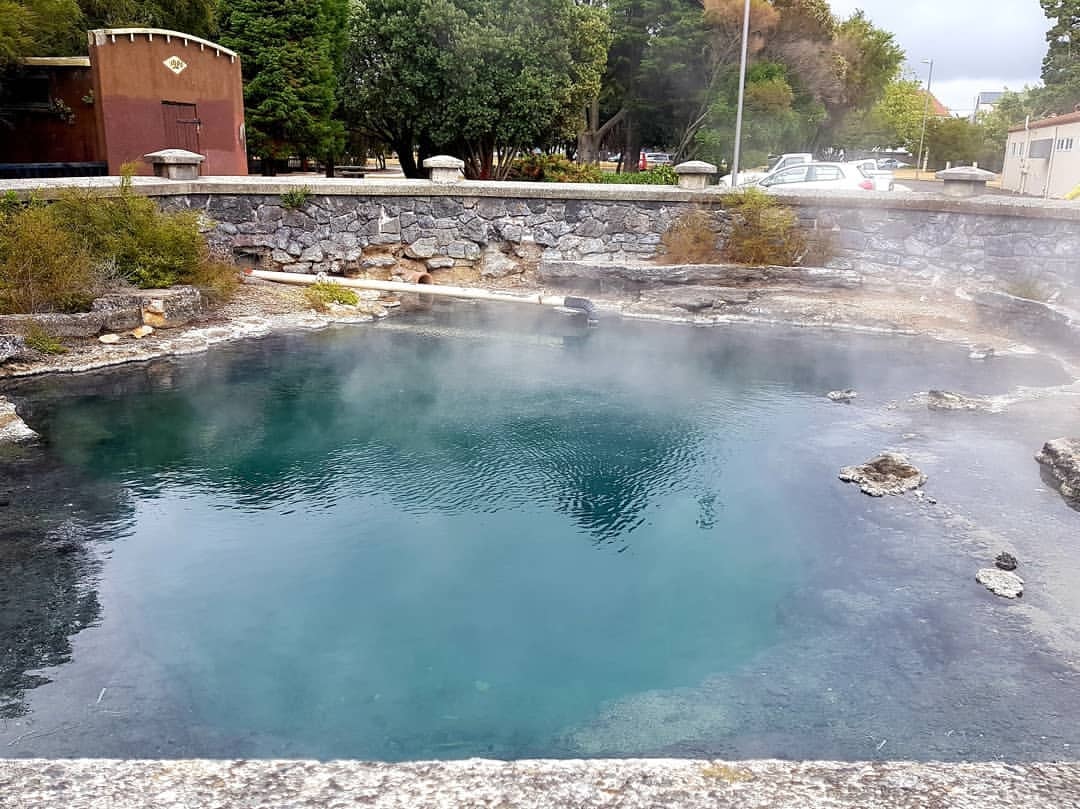 The Whangapipiro Rachel Pool steams away in central Rotorua New Zealand.