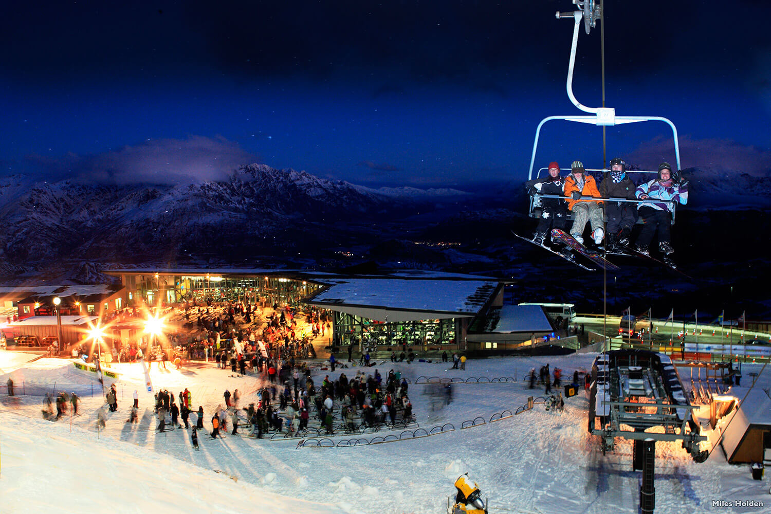 Crowds of people enjoy a night ski at Coronet Peak.