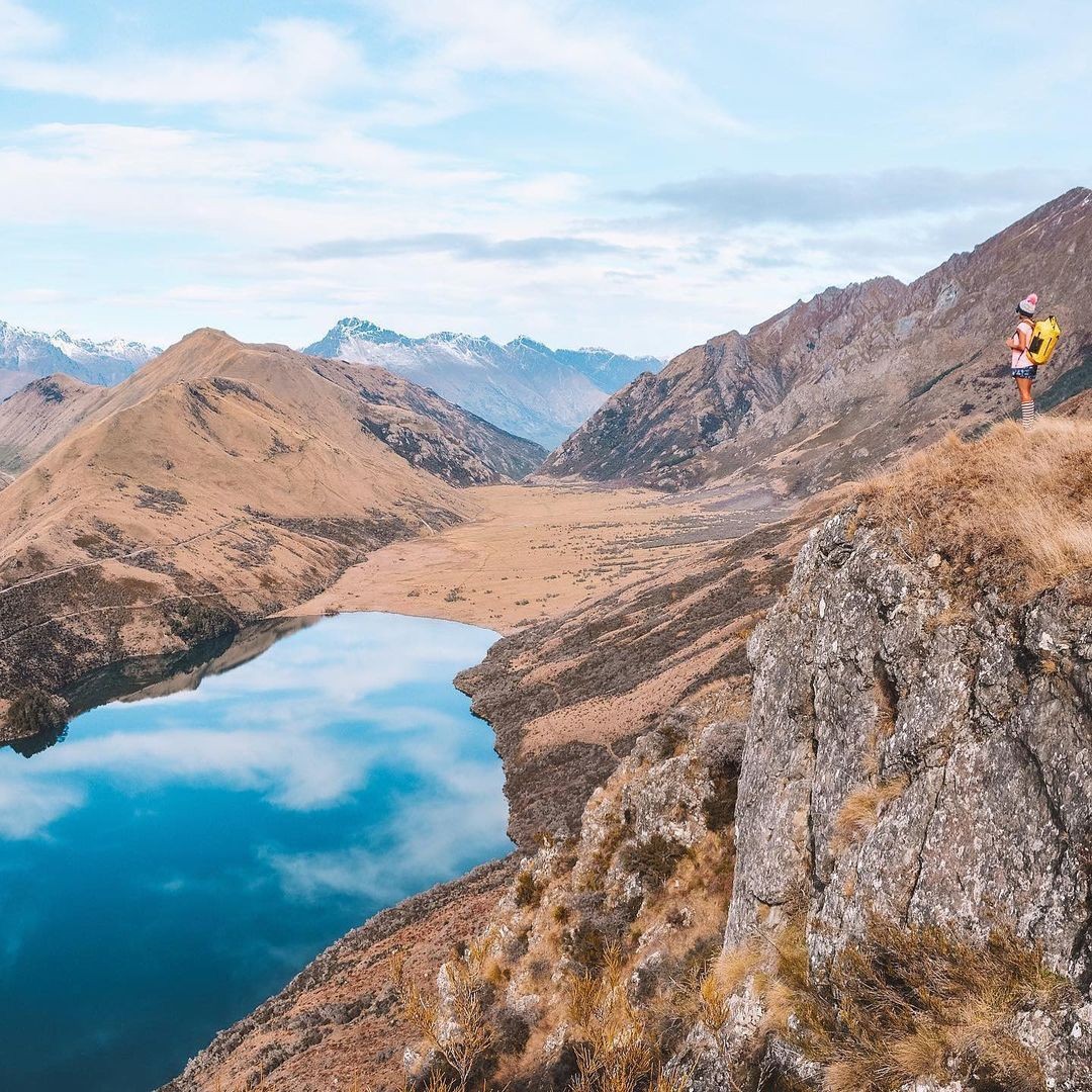 A lady marvels at a spectacular outlook of Moke Lake in Queenstown.
