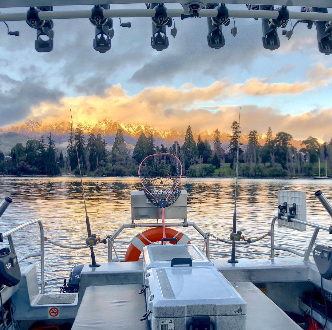 A sunset as seen from a fishing charter boat on Lake Whakatipu.