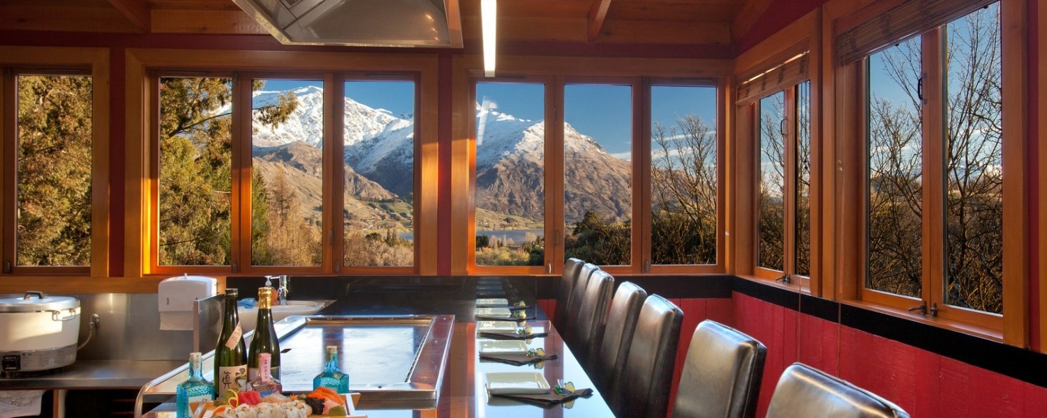 A hot grill plate and seating area in the scenic Kobe Restaurant at Millbrook Queenstown.