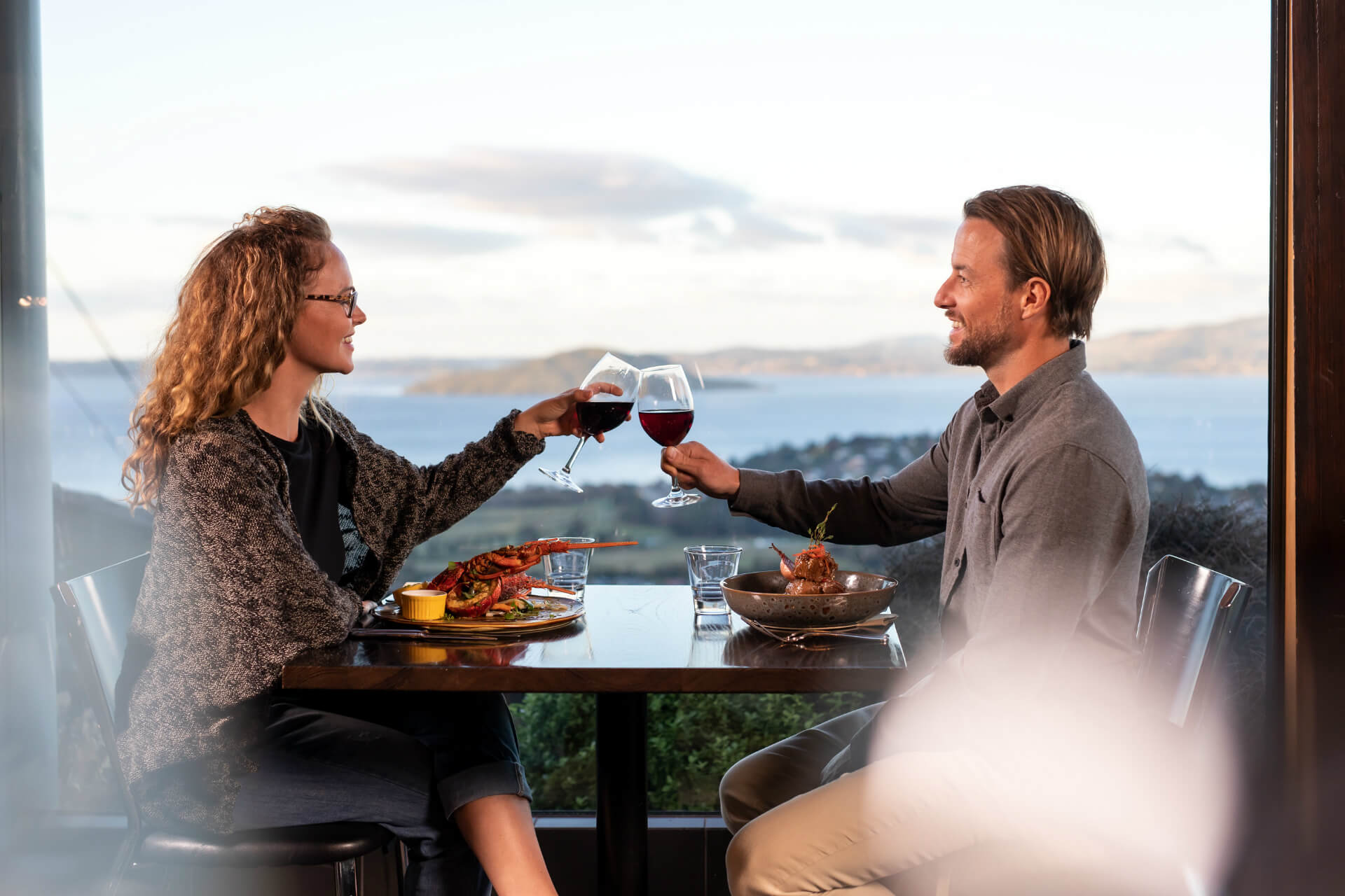 A Couple Making A Toast And Clinking Glasses At The Skyline Rotorua Stratosfare Restaurant 