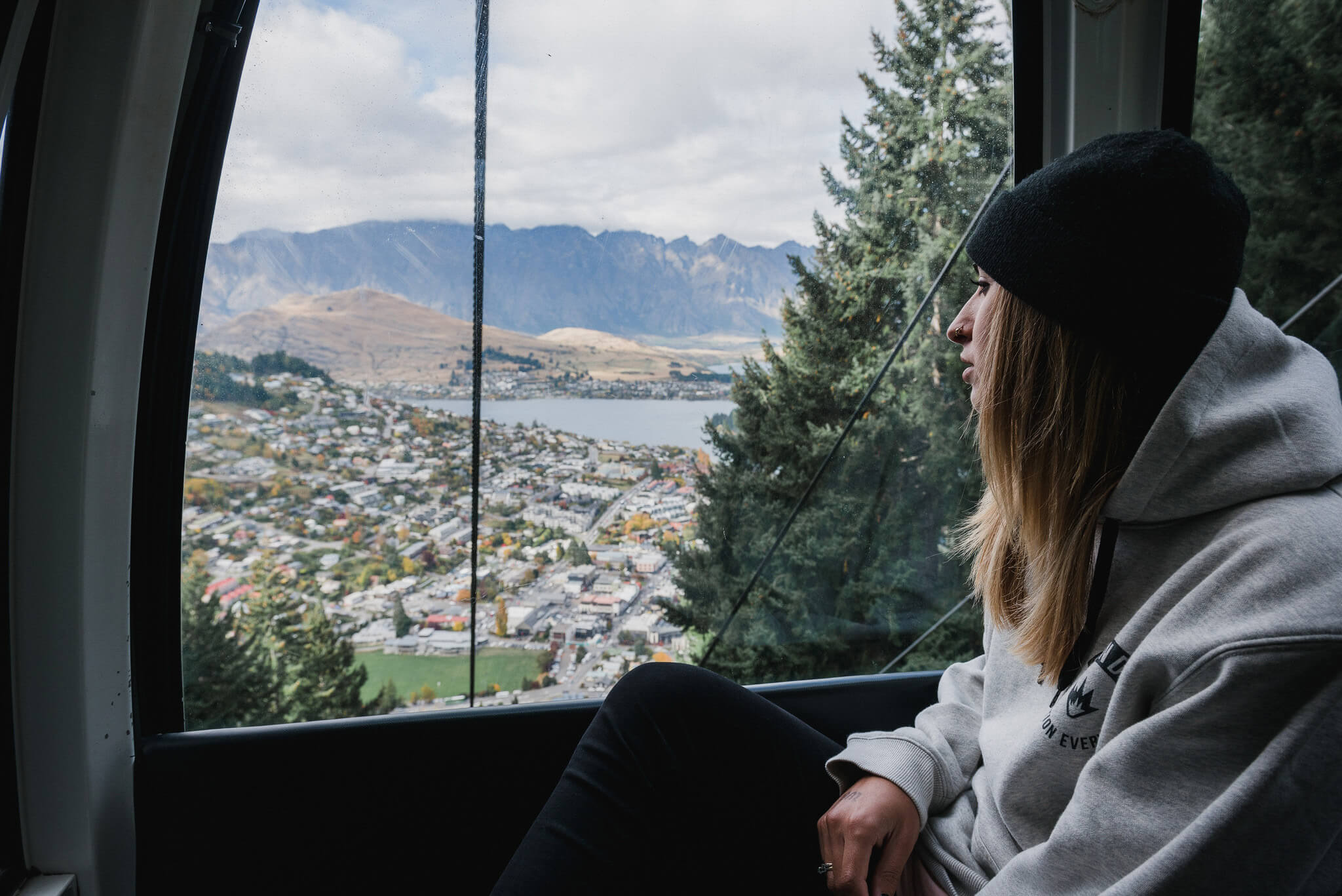 Woman enjoying the view over Queenstown from the Gondola.