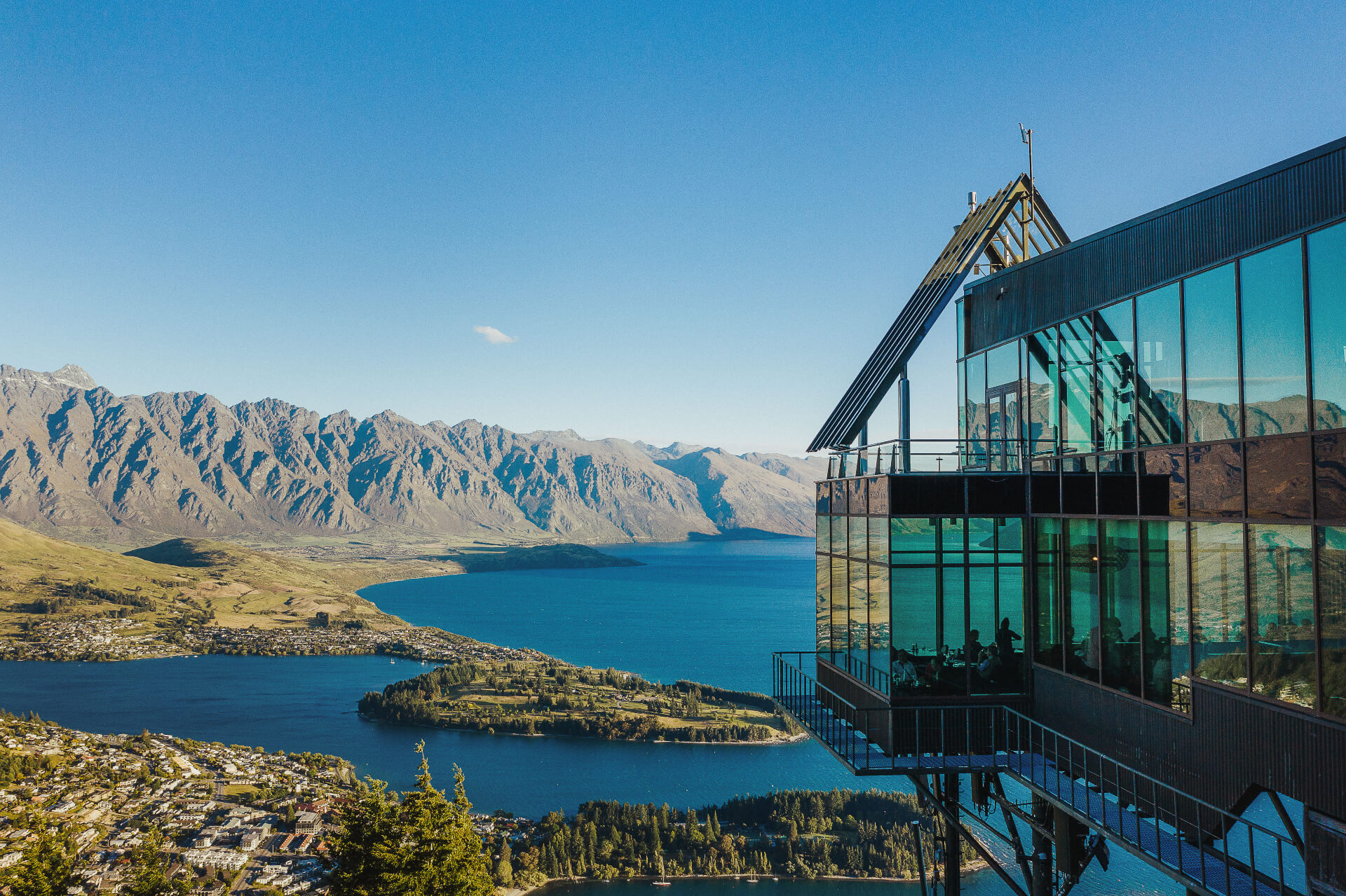 The Skyline Queenstown building shimmers in the foreground with stunning views of Queenstown as the backdrop.