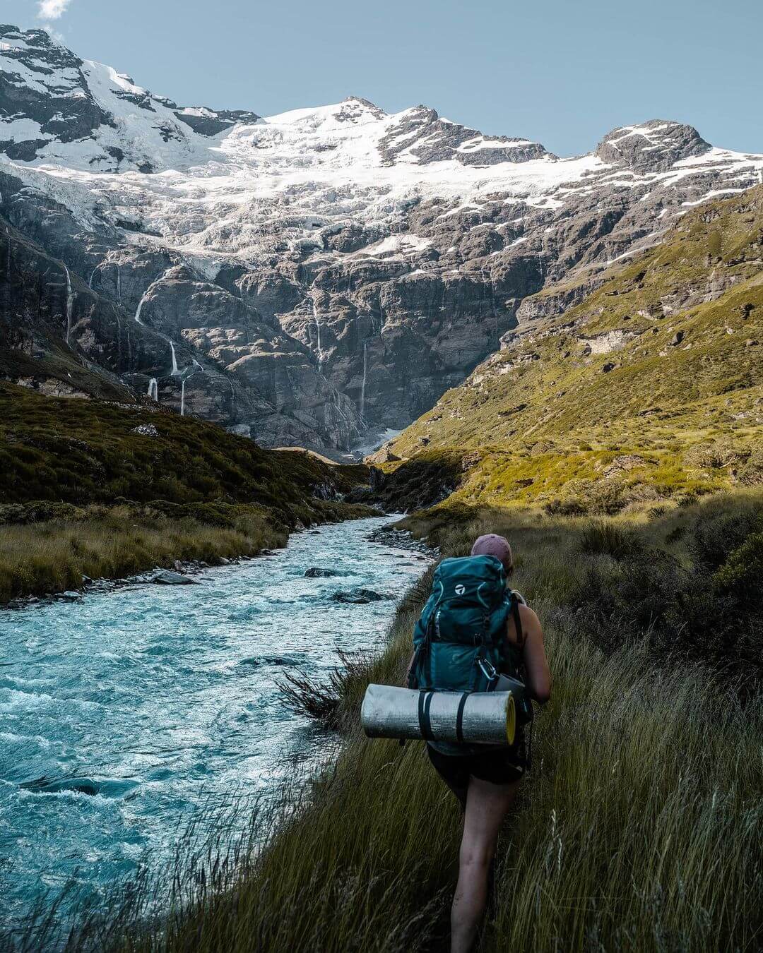 An adventurer makes her way to the base of the Earnslaw Glacier in the Mount Aspiring National Park.