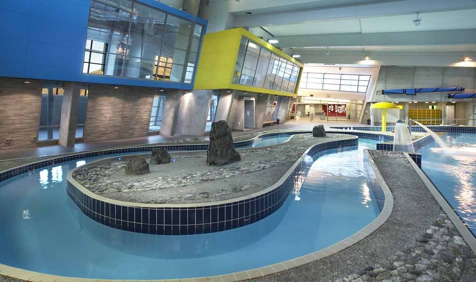 An indoor lazy river swimming pool at a Alpine Aqualand