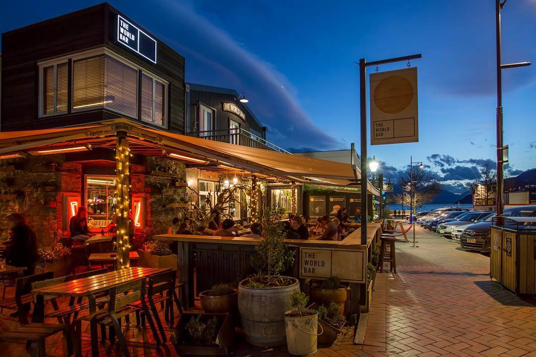 The World Bar venue from outside with a dusk sky above.