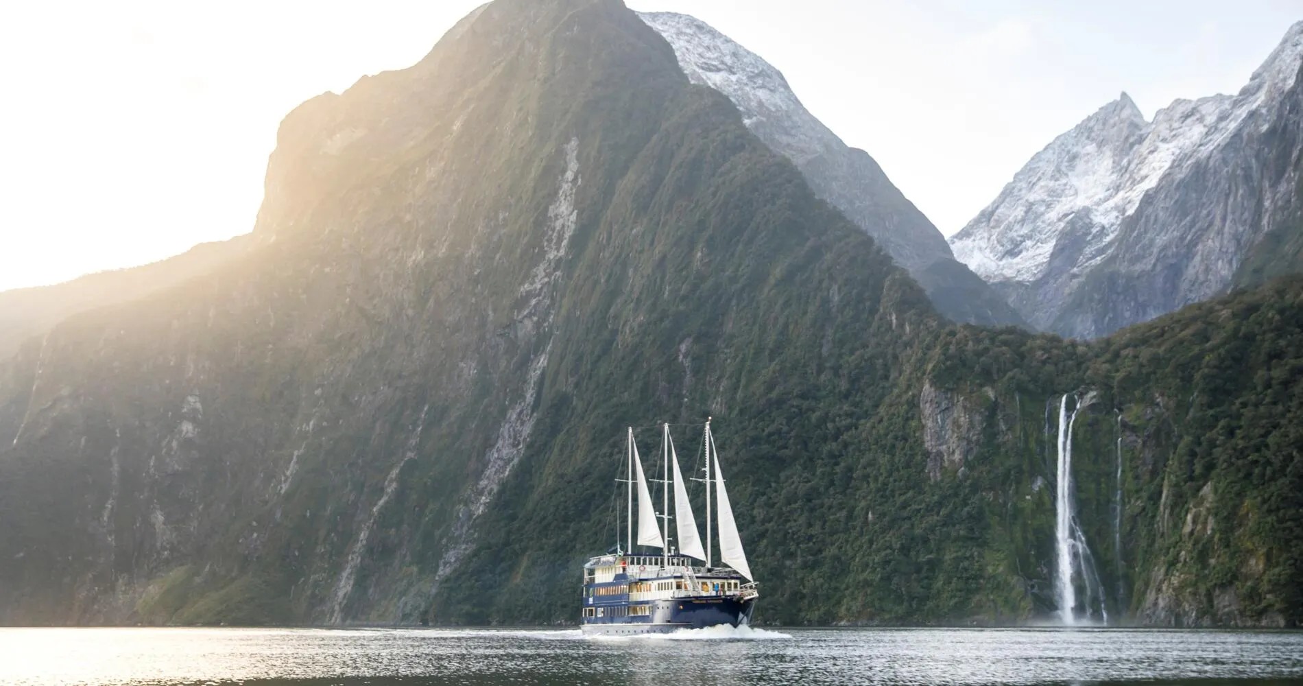 Boat sailing around the Milford Sound.