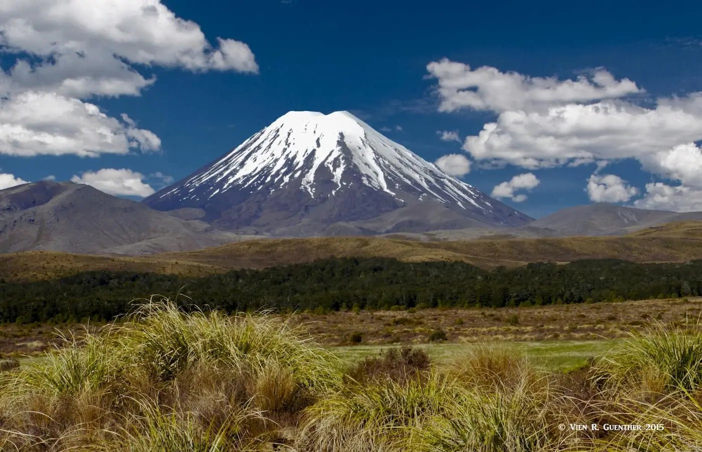 Snow-capped Mount Ngauruhoe on a slightly cloudy day.
