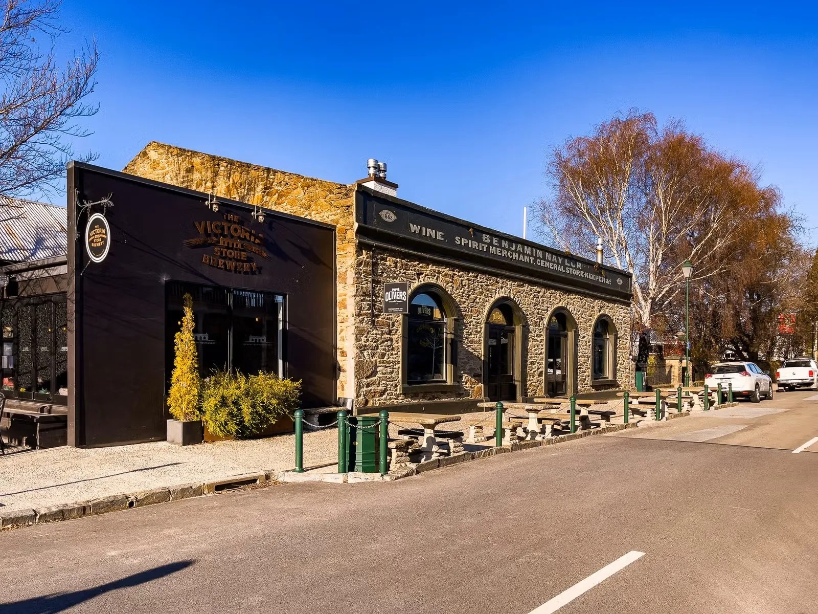 Victoria Store Brewery in Clyde with stone building and outdoor seating area.