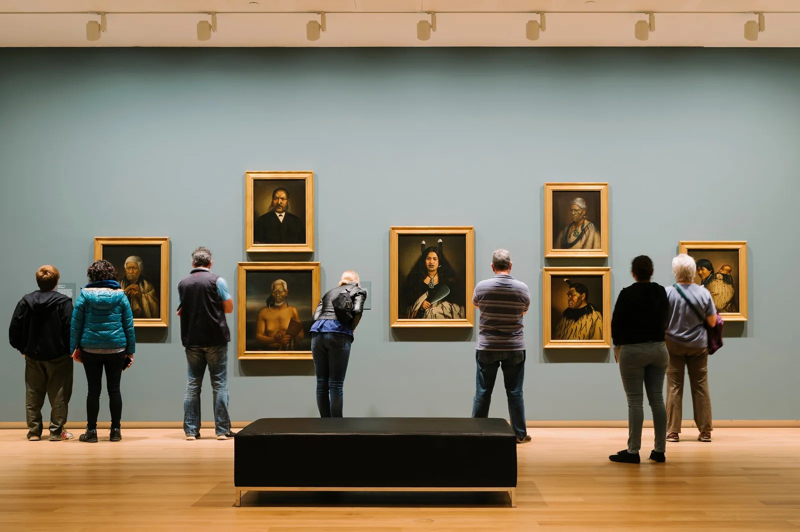 People viewing Lindauer's Māori portraits at Auckland Art Gallery.