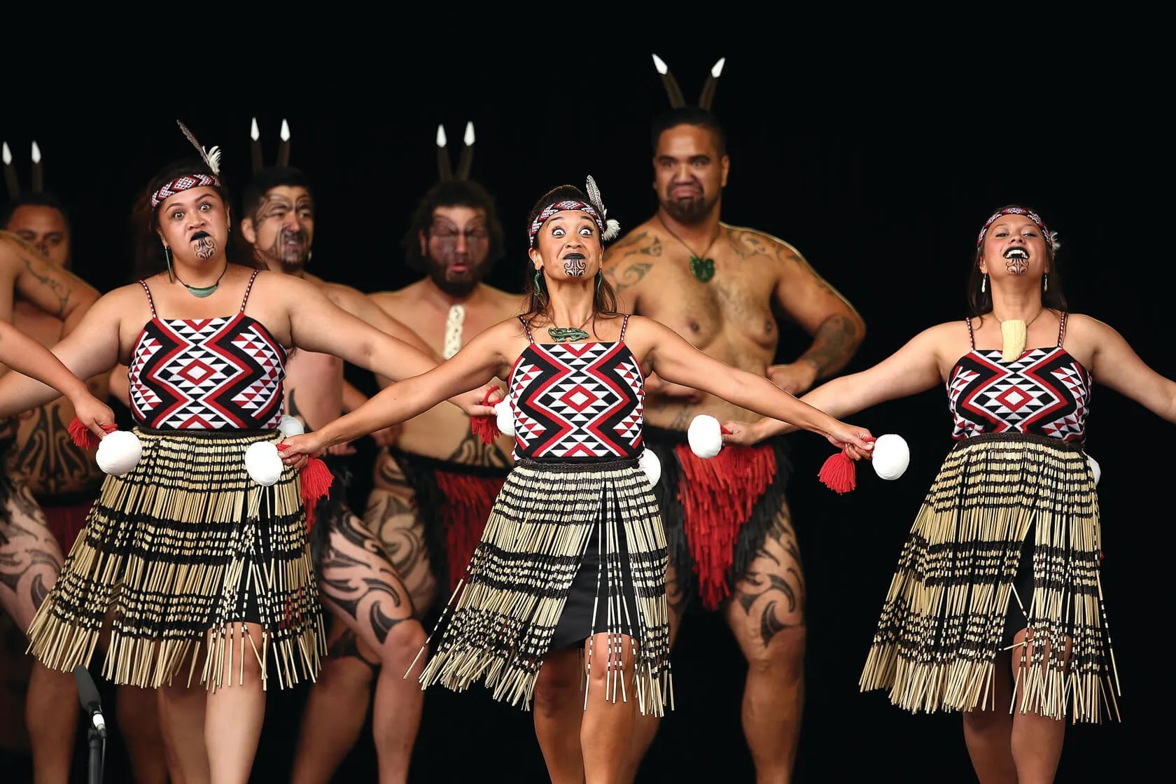 Māori cultural group performing traditional haka dance.