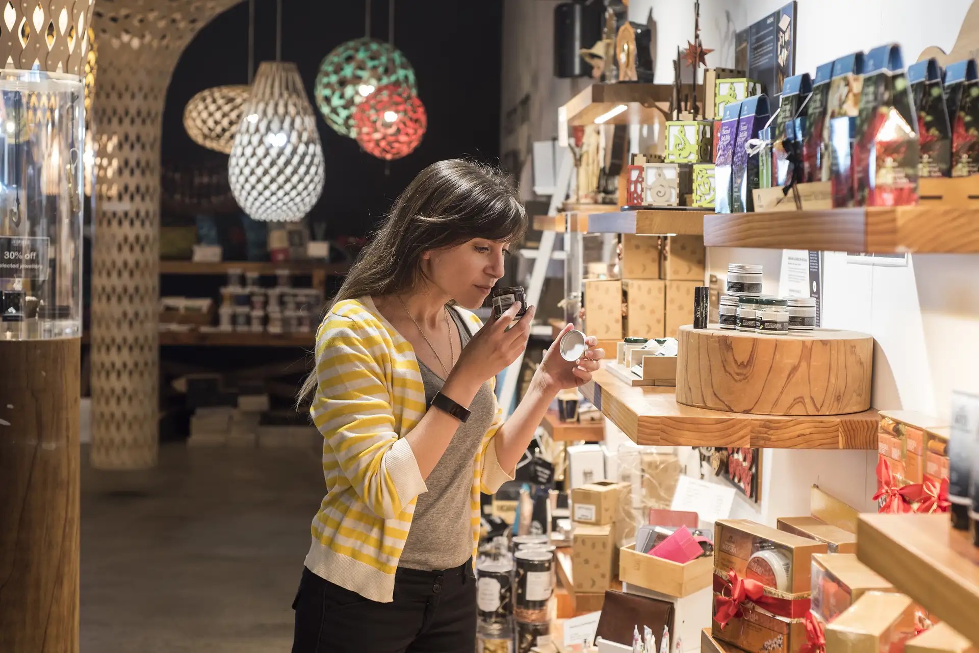 Customer testing a product inside the iNZpired souvenir store.