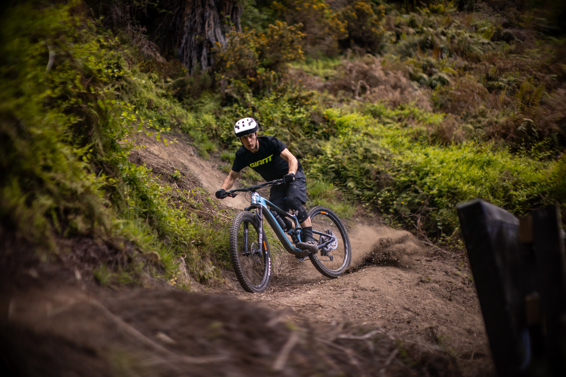 Bike rider cycling on a rough mountain track.
