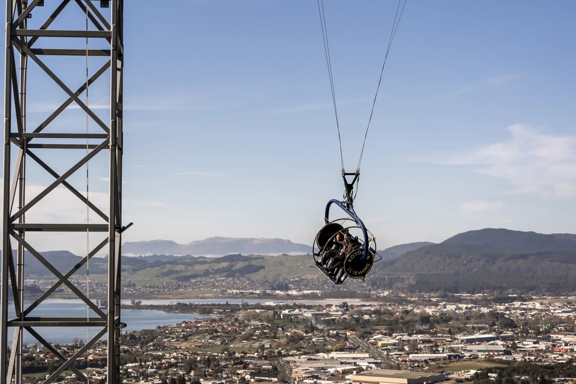 Family riding the Skyswing in the air.