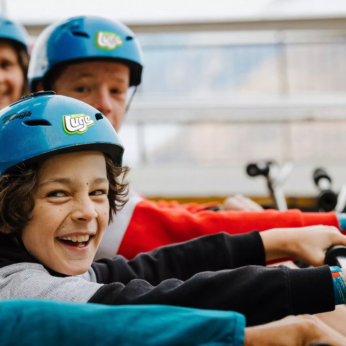 A group of kids prepare to ride the Luge at Skyline Queenstown.