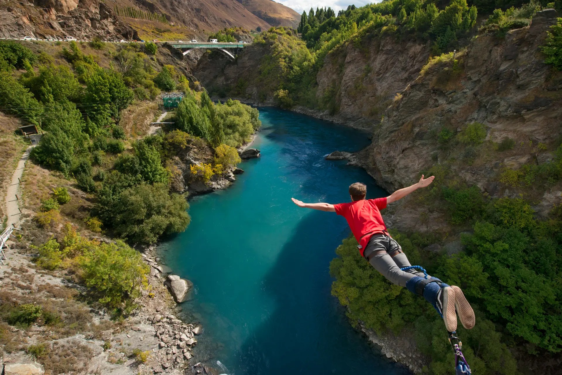 Person bungee jumping off Kawarau Bridge into the river.