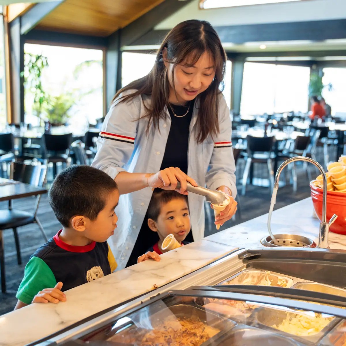 Family enjoying ice cream dessert at Skyline Rotorua Stratosfare Restaurant buffet