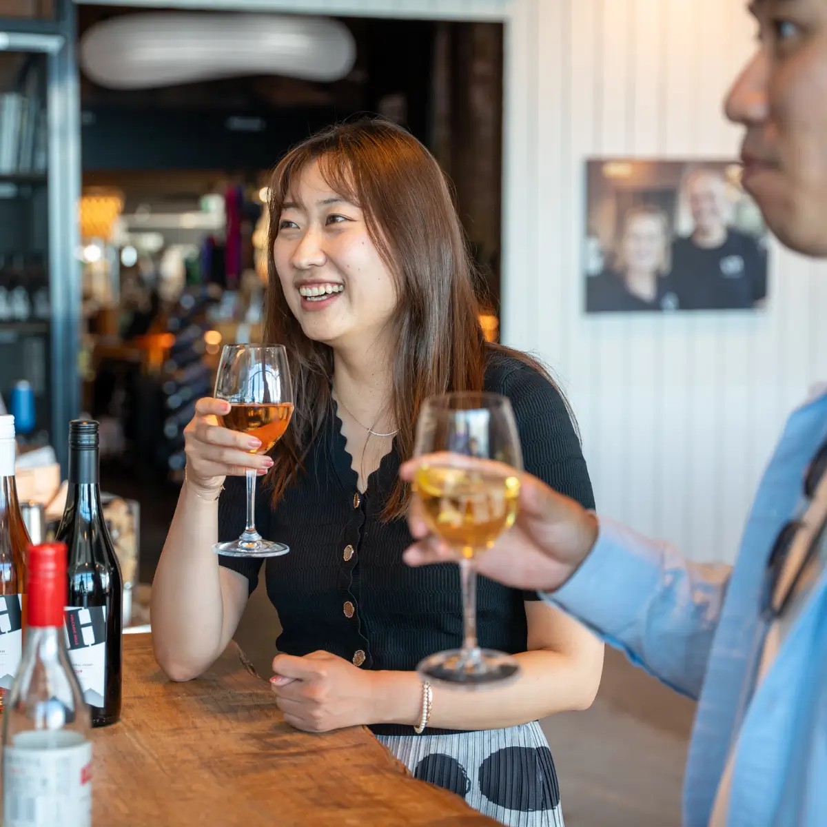 Guests enjoying wine tasting at Skyline Stratosfare bar with selection of local wines