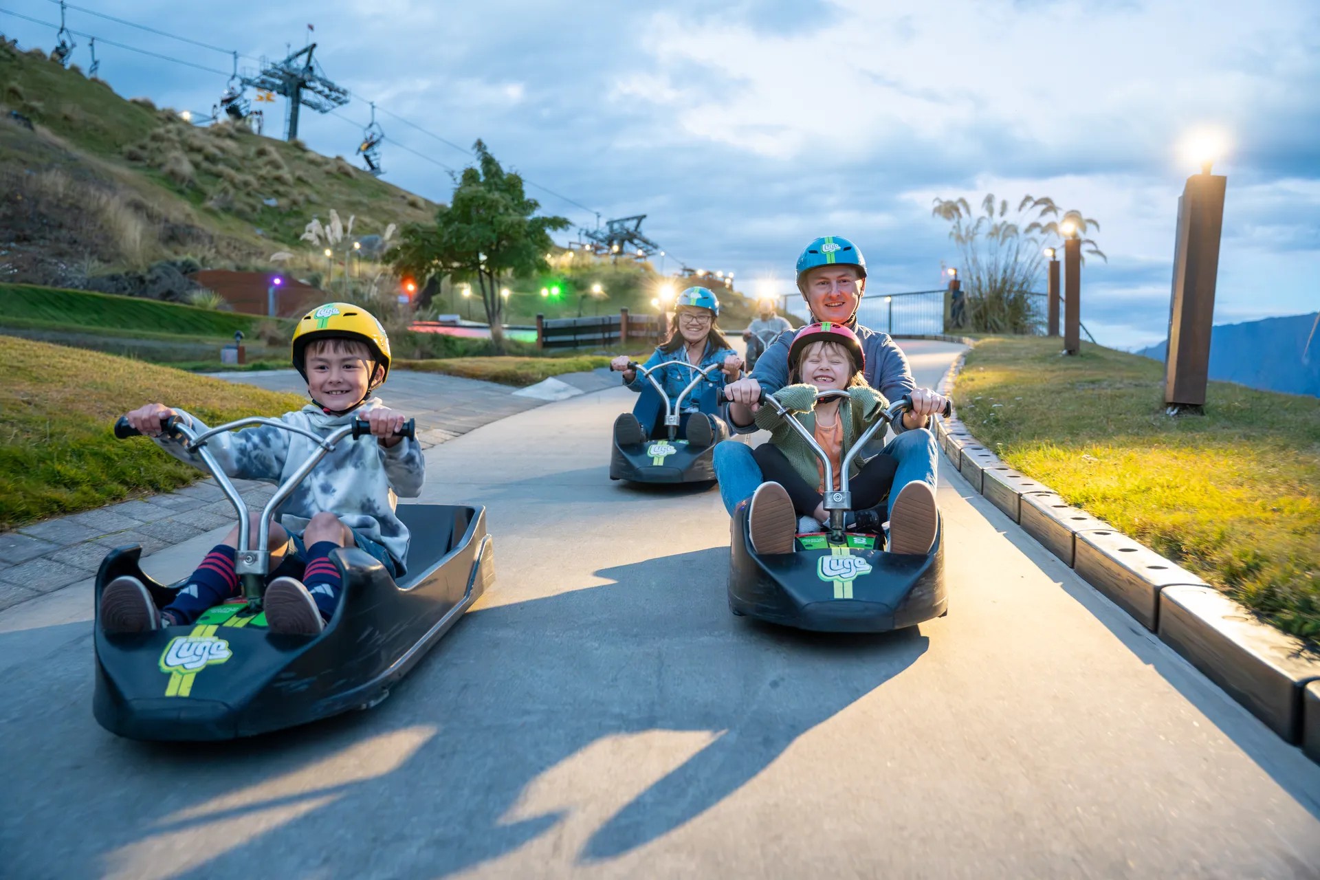 Family riding Skyline Queenstown luge together.