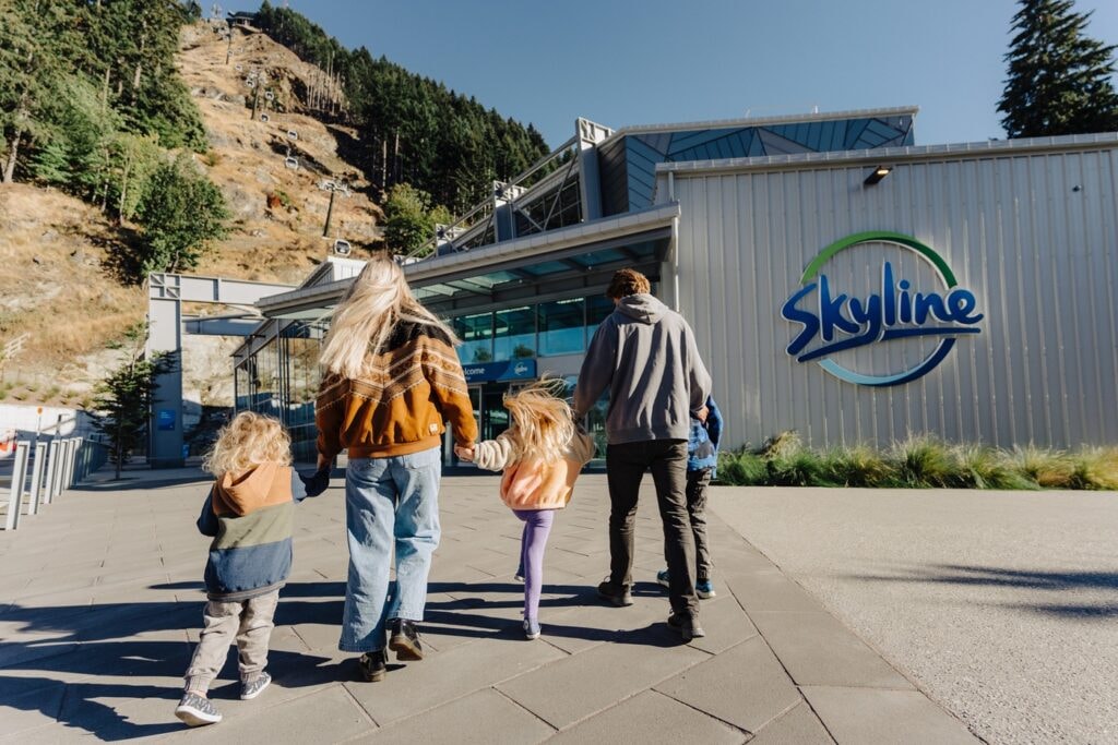 A family approaches the Skyline Queenstown main entrance for the Gondola.