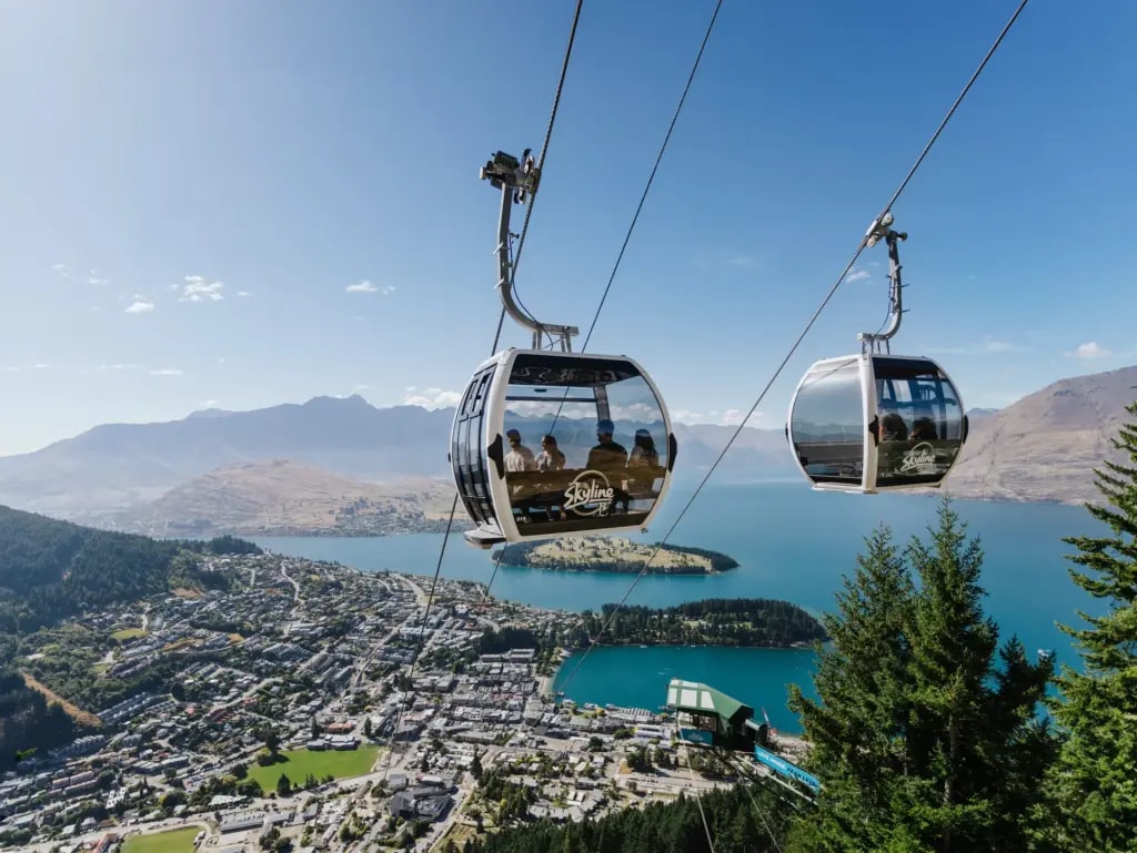 Two Skyline Gondola carriages high above Queenstown and Lake Wakatipu