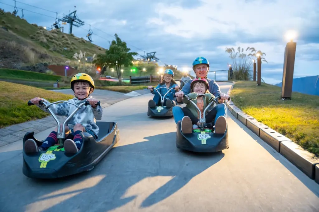 Family riding Skyline Queenstown luge together.