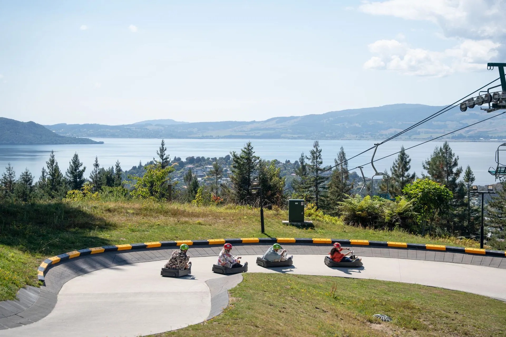 Skyline Luge cart racers going around a turn