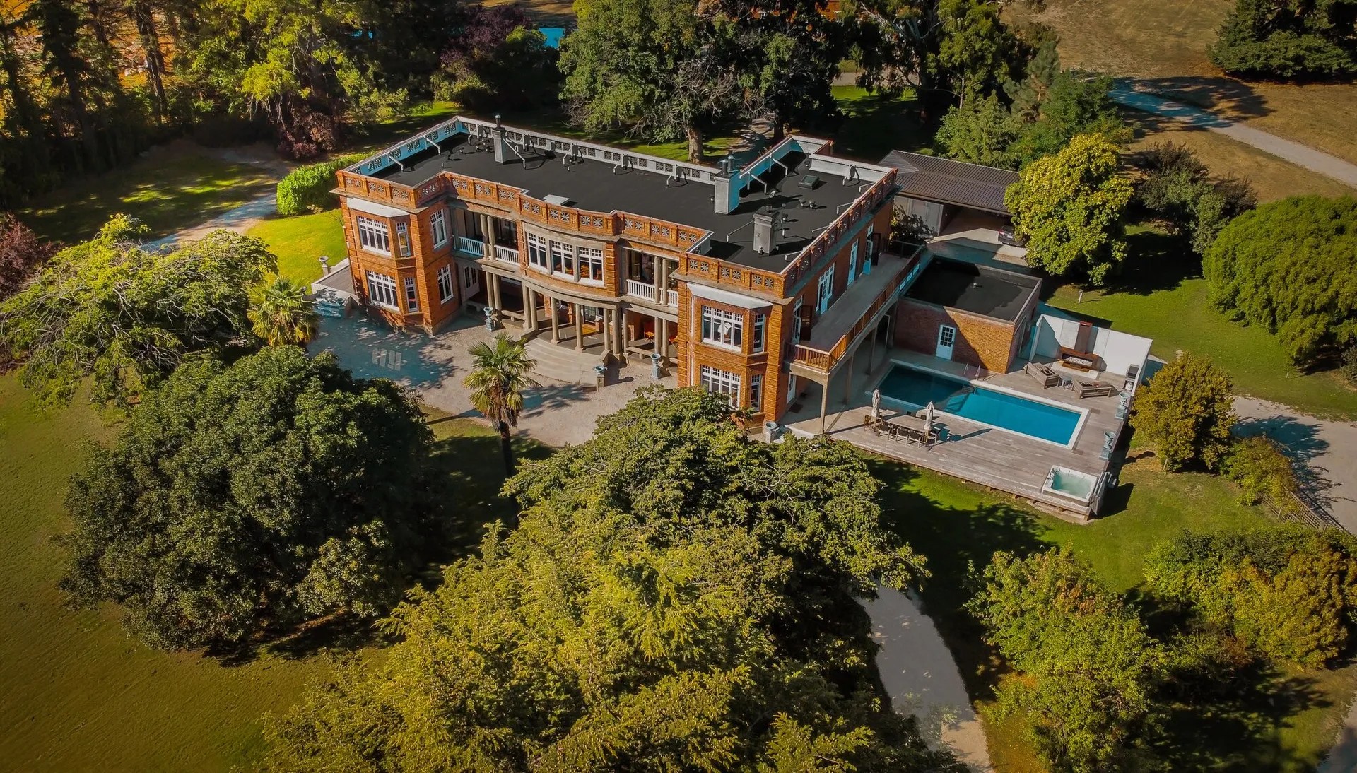 A historical brick manor in a rural setting